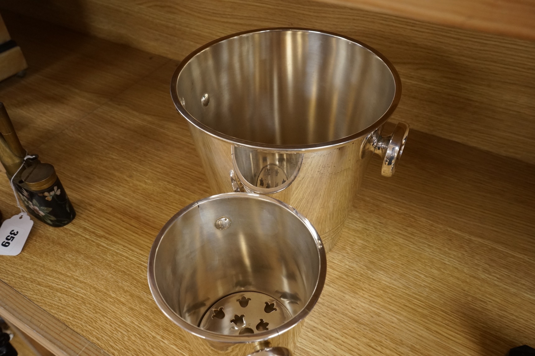 A plated champagne bucket and an ice bucket, St Medard, largest 19cm high